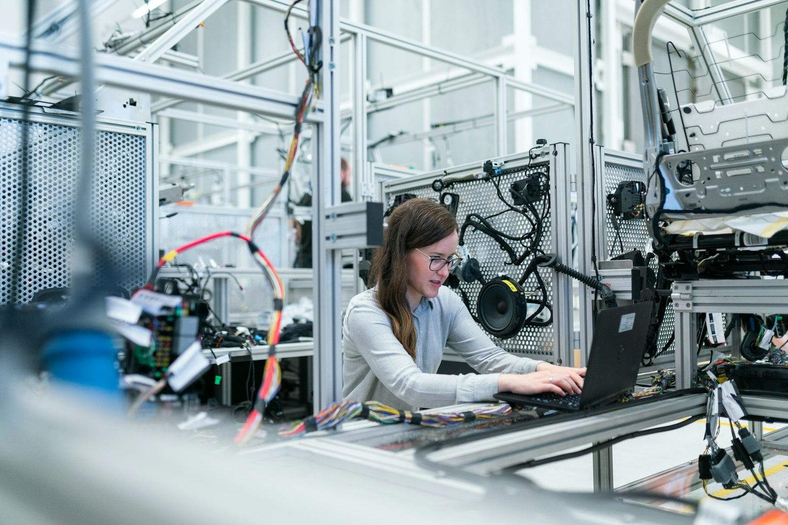 Engineer working at an assembly line workstation